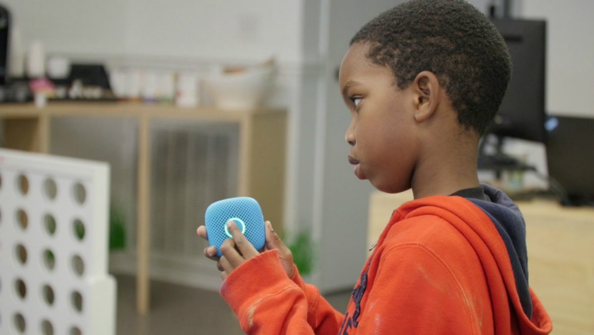 Boy Holding Relay | Tech Team Uses Their Kids As Inspiration To Develop Safer, Screenless Smartphone